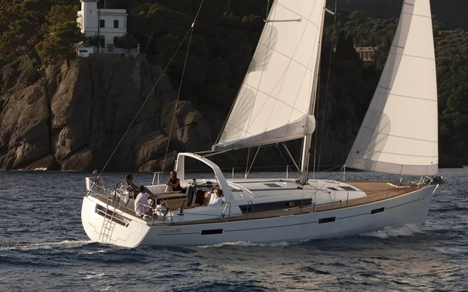Beneteau Oceanis 45 under white sails on a beam reach